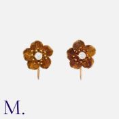 A Pair of Antique Diamond Earrings in yellow gold, each in the form of a flower set with an old
