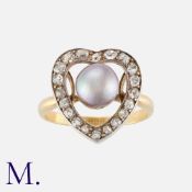 A Fine Pearl and Diamond Ring in 18K yellow gold with central natural saltwater pearl (accompanied