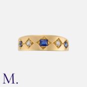 An Antique Sapphire and Diamond Gypsy Ring in 18K yellow gold, with three old cushion cut