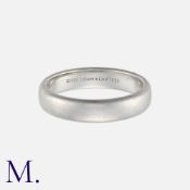 TIFFANY & Co. A Platinum Band. Signed Tiffany & Co. and serial numbered. Marked PT950 for
