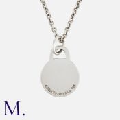 TIFFANY & Co. A Dog Tag Pendant Necklace, Marked 2001, Tiffany & Co 925. Size Pendant: 3.2cm