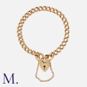 A Gold Curb Bracelet in 9K gold with padlock fastening. Marked for 9ct gold. Size: 19.0mc Weight: