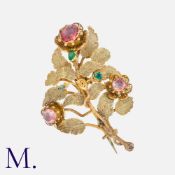 An Antique Gem-Set Flower Brooch in yellow gold, set with green and pink gemstones (foil-backed)