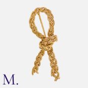 HERMES. A Woven Knot Brooch in 18K yellow gold. Signed Hermes Paris. French marks for 18ct gold.