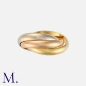 CARTIER. A Trinity Ring in 18K yellow, white and rose gold, made up of three interlinked bands.
