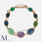 An Antique Scarab Bracelet in 9K yellow gold, set with carved scarab gemstones including inter
