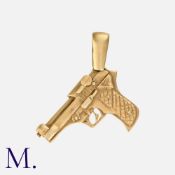 A Gold Pistol Pendant in 9 carat yellow gold, designed as a pistol. Hallmark for 9 carat gold. Size: