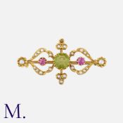 An Antique Suffragette Pendant Brooch in 15K yellow gold, set with an octagonal-cut peridot to the