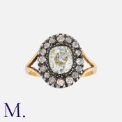An Old Cut Diamond Cluster Ring, in yellow gold and silver, set with a principal old cut diamond
