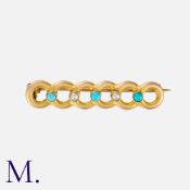 A Turquoise and Pearl Brooch in yellow gold, in a curb-link form with turquoise and pearl accents.