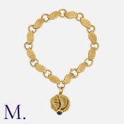 GEORGES LENFANT. A Bracelet with Charm with alternating woven and smooth links in 18K yellow gold,
