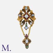 An Antique Opal, Ruby and Emerald Brooch in yellow gold, set with cabochon opals, rubies and
