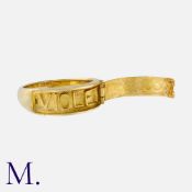 An Antique Etruscan Revival Ring in yellow gold, with hinged wirework decoration opening to reveal