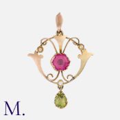 An Antique Suffragette Pendant in yellow gold, set with a hexagonal pink gemstone, peridot and pearl