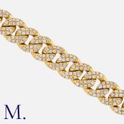 A Diamond Curb Link Bracelet in yellow gold, comprising a series of interlocking curb links, set