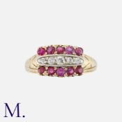 An Antique Ruby and Diamond Ring in 18 carat yellow gold, comprising a row of five old cut