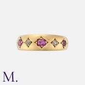 A Ruby and Diamond Five Stone Ring in 18 carat yellow gold, set with three cushion cut rubies,