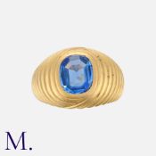 A Vintage Sapphire Bombé Ring in yellow gold, the large, fluted ring set with a flat topped blue
