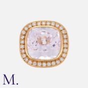 A Kunzite and Diamond Ring in 18 carat rose gold, comprising a principal mixed cut kunzite of