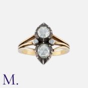 An Antique Rose Diamond Ring in yellow gold and silver, set with two principal bright rose cut