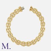 CARTIER. A Five Row 'Gentiane' Necklace in 18 carat yellow gold, comprising a series of interlocking