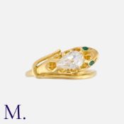 An Antique Diamond and Emerald Snake Ring in yellow gold, designed as a coiled snake, set to the