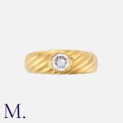 A Diamond Gypsy Ring in yellow gold, the band featuring twisted, fluted decoration, set with a round