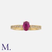 A Ruby And Diamond Ring in 18k yellow gold, set with an oval cut ruby of approximately 0.90ct,