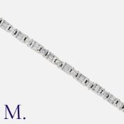A Diamond Bracelet in white gold, set with round cut and baguette-cut diamonds weighing approx. 3.
