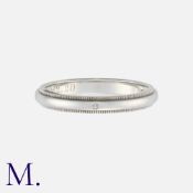 TIFFANY & Co. A Diamond Together Milgrain Band in platinum. Signed Tiffany and 'PT950'. Size: Q1/2