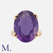A Large Amethyst Ring in yellow gold, set with an oval cut amethyst weighing approximately 12.5ct.