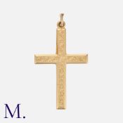 A Gold Crucifix Pendant in 9 carat yellow gold, with engraved decoration. Hallmark for 9 carat gold.