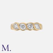 A Diamond Ring in 18 carat yellow gold, set with a row of four round brilliant cut diamonds