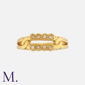 A Diamond Ring in 22 carat yellow gold, the bifurcated twisted band set with round cut diamonds.