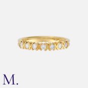 A Diamond Ring in 18K yellow gold set with seven round cut diamonds weighing approx. 0.10ct in