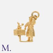 An Unusual Organ Grinder and Monkey Charm Pendant in 9 carat yellow gold, Marked 9, .375 for 9