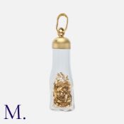 A Gold Flake Charm / Pendant in 9 carat gold, comprising a glass bottle, marked 375 for 9 carat