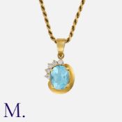 A Topaz and Diamond Pendant & Chain in 18K gold, the oval topaz accented with five diamonds. Stamped