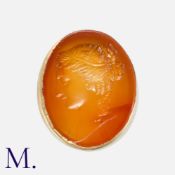 An Antique Intaglio Ring in yellow gold, set with an oval carnelian with an intaglio of a Greek