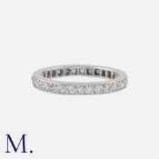 A Diamond Eternity Ring in white gold, set all around with single cut diamonds totalling