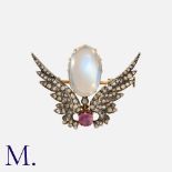 A Victorian Moonstone, Ruby and Diamond Brooch in winged form, with a large oval moonstone to the
