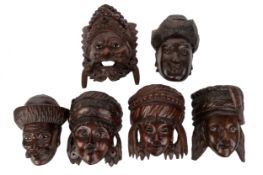 SIX EASTERN CARVED WOOD WALL MASKS, EARLY 20TH CENTURY