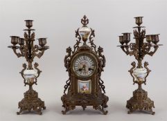 A bronze clock set with porcelain plaques. France, late 19th century. H. 45 cm.