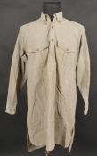 Chemise 1935. Modele reglementaire en tissu kaki se fermant par trois boutons, boutons a l arriere
