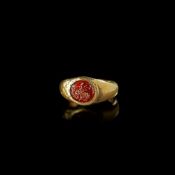 A HOLLOW ROMAN GOLD RING WITH A GARNET INTAGLIO OF AN EAGLE'S HEAD, 1ST CENTURY AD
