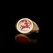 ROMAN GOLD RING WITH ORANGE INTAGLIO OF A HUNTING CENTAUR 1ST–2ND CENTURY A.D.