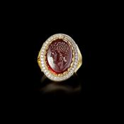 A ROMAN PORTRAIT INTAGLIO OF 'AELIUS' 2ND CENTURY AD, MOUNTED IN A 20 CENTURY GOLD RING, 18K WITH DI