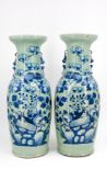 A Chinese pair of blue on celadon decorated porcelain vases with decor of pheasants on branches