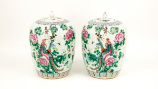 A Chinese pair of Famille rose decorated and glazed porcelain covered ginger vases