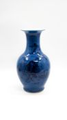 A Chinese dark blue figurative decorated porcelain vase with blue fond glaze